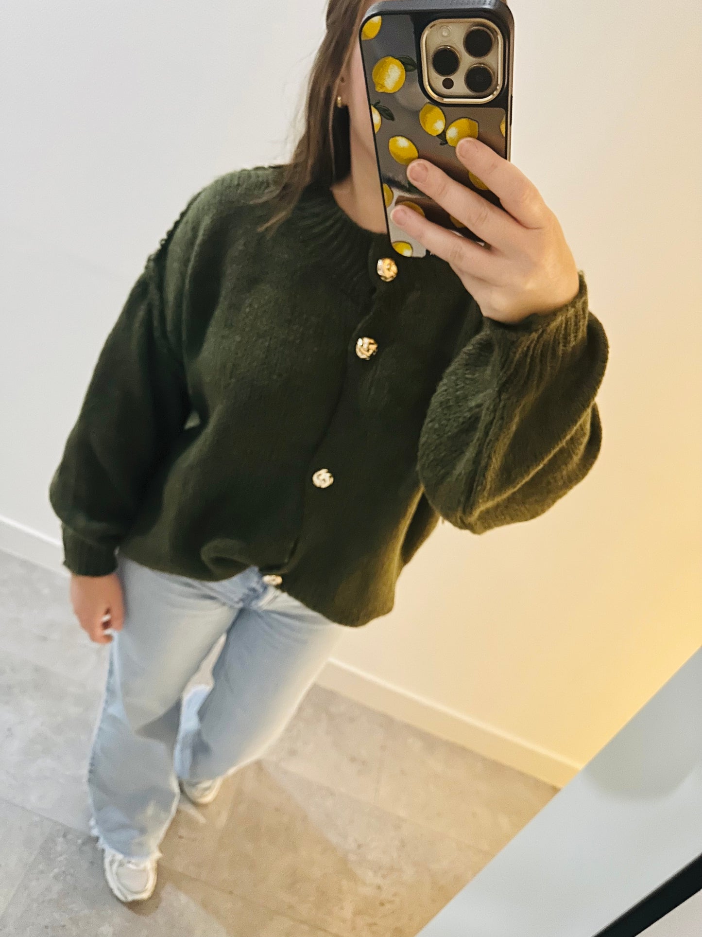 Groene vest met gouden knopen