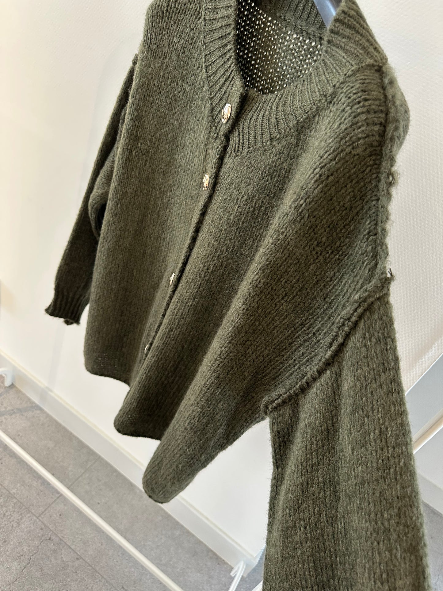 Groene vest met gouden knopen